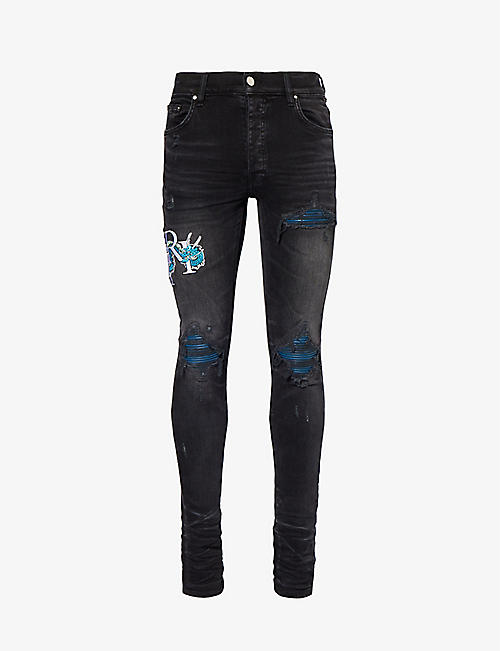 AMIRI: Dragon brand-embroidered slim-fit stretch-denim jeans