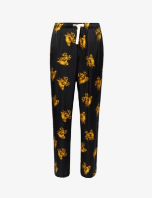 Shop Palm Angels Burning Brand-print Relaxed-fit Satin Trousers In Black Gold