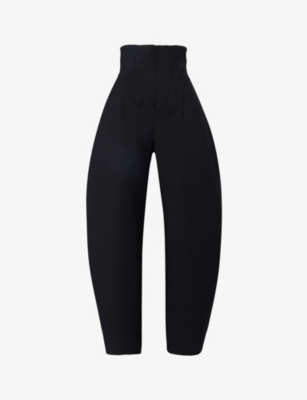 ALAIA: Corseted curved-leg high-rise wool-blend trousers