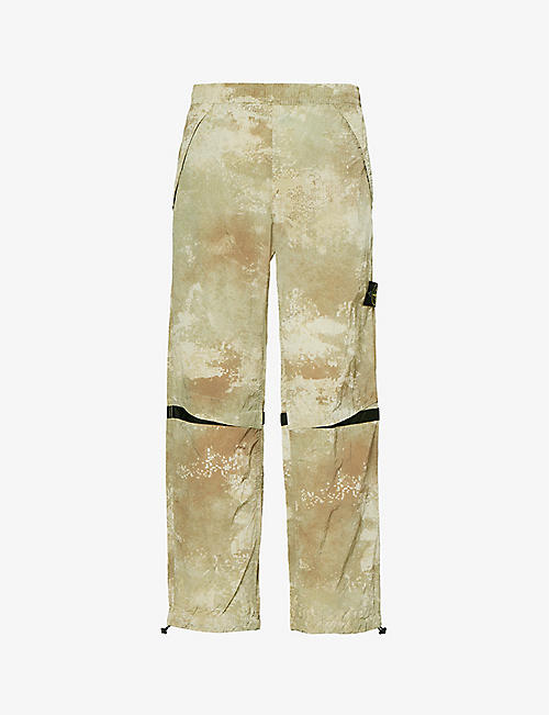 STONE ISLAND: Dissolve camouflage-pattern shell trousers