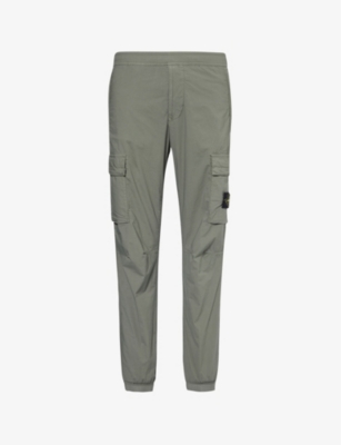 STONE ISLAND: Logo-badge tapered-leg stretch-cotton cargo trousers