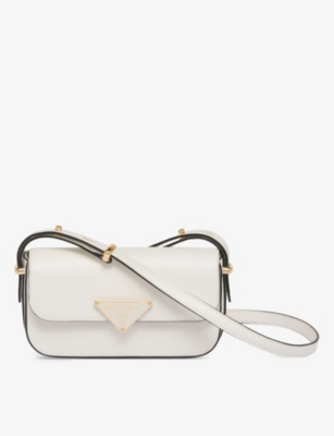 PRADA Logo plaque leather cross body bag Selfridges