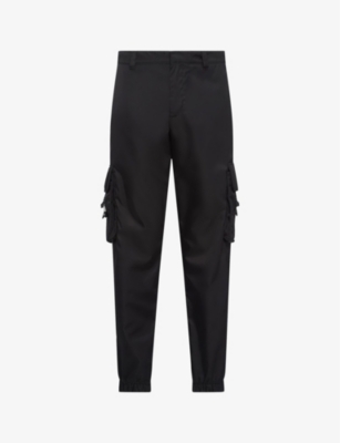 PRADA: Re-Nylon buckle-embellished tapered slim-fit recycled-nylon trousers