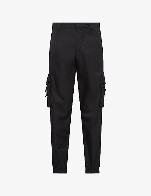 PRADA: Re-Nylon buckle-embellished tapered slim-fit recycled-nylon trousers
