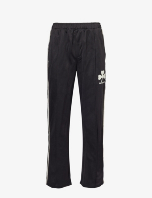 BASKETCASE: Lucky branded-print woven trousers