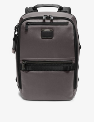 TUMI: Dynamic multi-pocket shell backpack