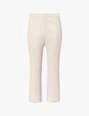 Shop Issey Miyake Pleats Please  Women's Cream Pleated Mid-rise Flared-leg Knitted Trousers