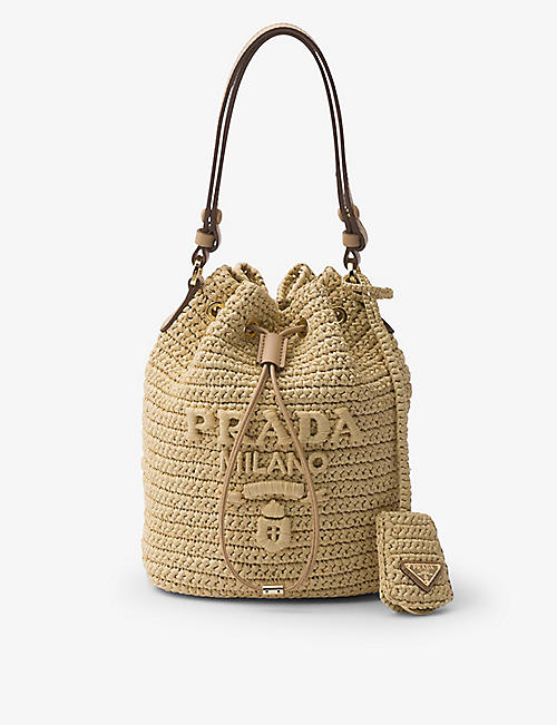 PRADA: Logo-embroidered raffia bucket bag