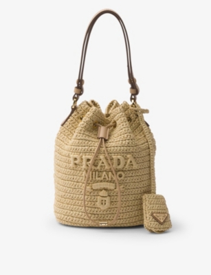Shop Prada Logo-embroidered Raffia Bucket Bag In Neutral
