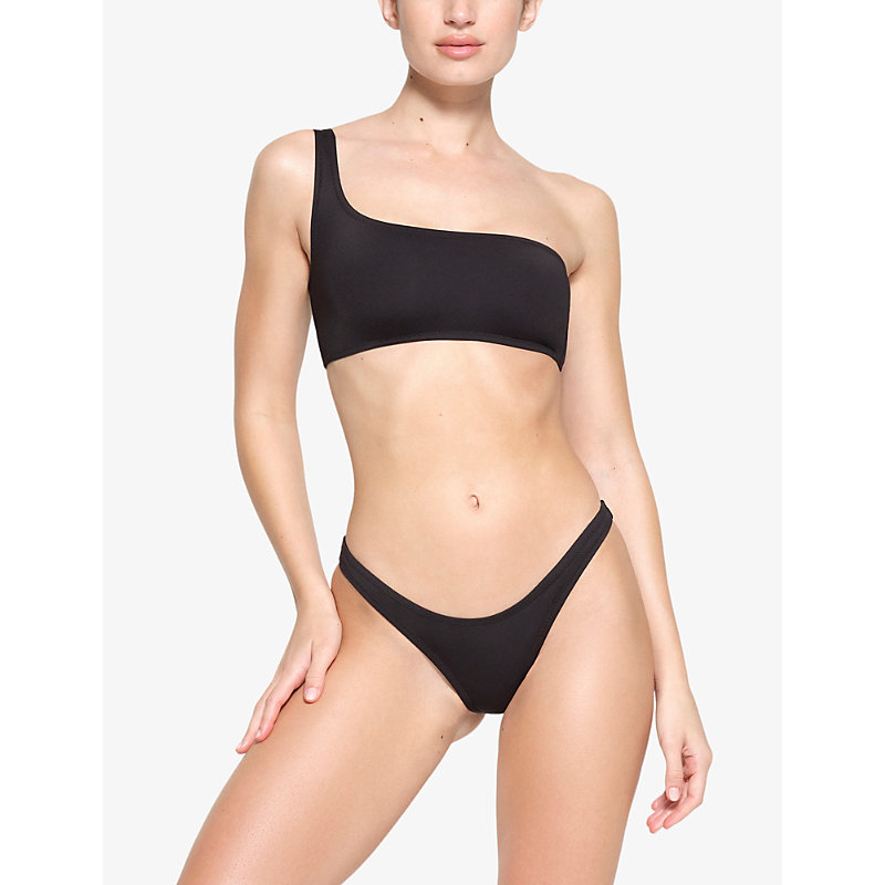 Shop Skims One Shoulder Recycled Stretch-nylon Bikini Top In Onyx