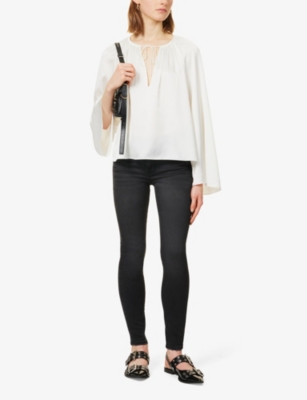 Logo-embellished tapered-leg high-rise stretch denim-blend jeans