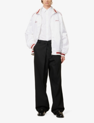 Shop Givenchy Men's Black Brand-appliquéd Pleated Regular-fit Wide-leg Woven Trousers