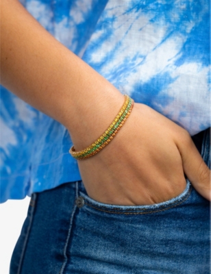 ROXANNE FIRST: Tennis 14ct yellow-gold and 3ct tsavorite bracelet