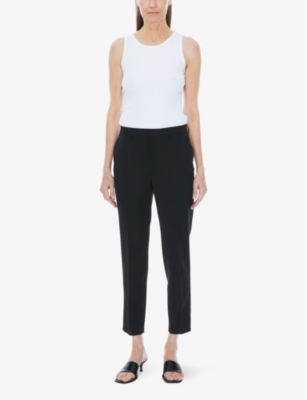 Shop Filippa K Emma Cropped Tapered-leg Mid-rise Stretch-wool Trousers In Black