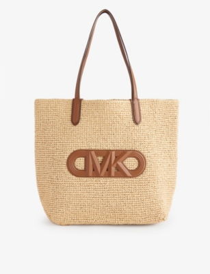 Shop Michael Michael Kors Xl Brand-appliquéd Straw Tote Bag In Nat/lugg