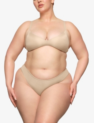 SKIMS: Wireless Form logo-embossed plunge stretch-cotton bra