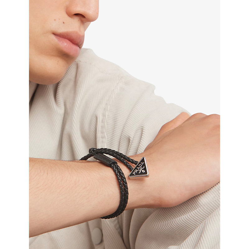Shop Prada Mens Black Brand-plaque Braided Leather Bracelet
