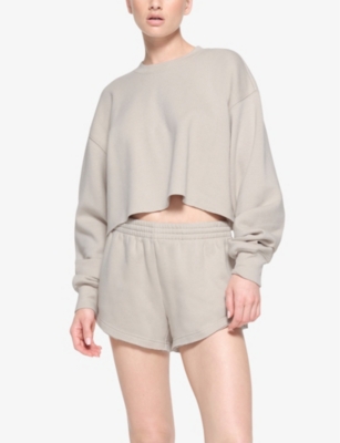 Shop Skims Loose-fit Cropped Cotton-blend Sweatshirt In Stone
