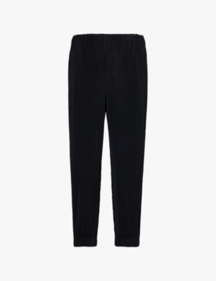 HOMME PLISSE ISSEY MIYAKE: Tapered-leg high-rise knitted trousers