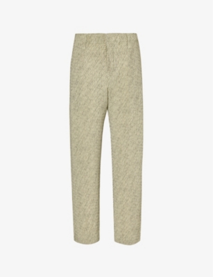 HOMME PLISSE ISSEY MIYAKE: Pleated tapered-leg knitted trousers