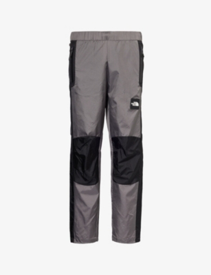 Shop The North Face Men's Smoked Pearl/black Wind Brand-patch Straight-leg Mid-rise Shell Trousers