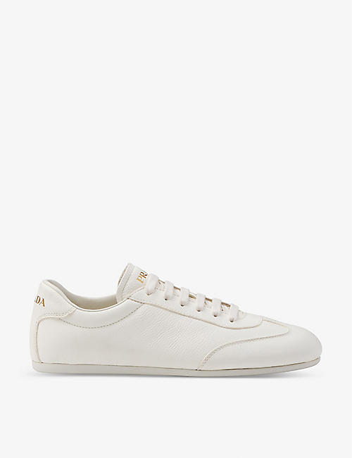 PRADA: Brand-plaque panelled leather low-top trainers