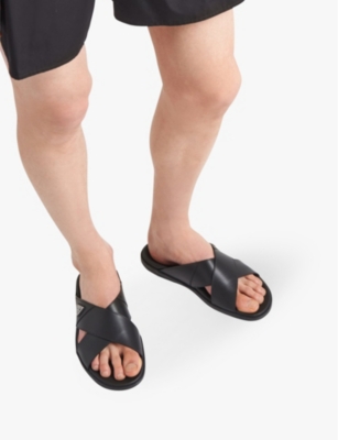 PRADA: Brand-plaque criss-cross leather slides