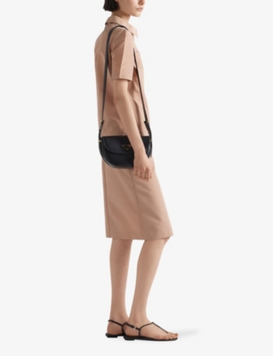 PRADA: Arqué brand-plaque leather shoulder bag