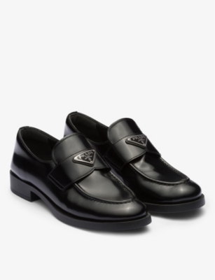PRADA: Logo-plaque leather loafers