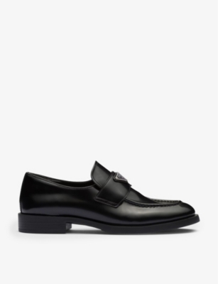 PRADA: Logo-plaque leather loafers