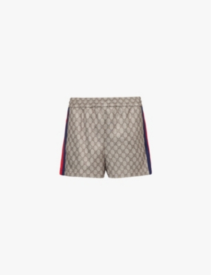 GUCCI: Monogram-print striped-panel woven-blend shorts