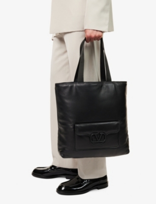 Shop Valentino Garavani Nero Logo-embossed Leather Tote Bag