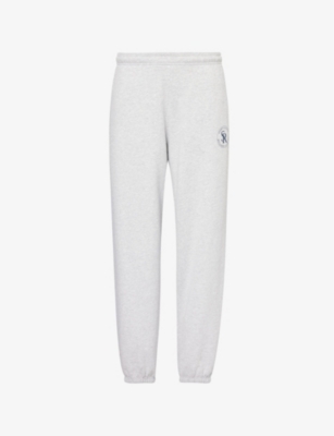 Shop Sporty And Rich Brand-patch Cuffed Cotton-blend Jersey Jogging Bottoms In Heather Gray