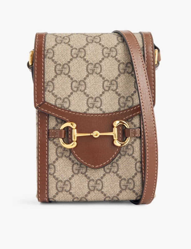 Monogram-print horsebit-embellished coated-canvas cross-body bag