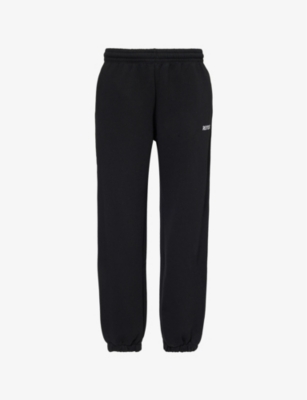 Shop Rotate Birger Christensen Rotate Sunday Women's Black Tapered-leg Mid-rise Organic-cotton Jogging Bottoms