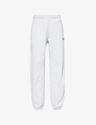 Shop Rotate Birger Christensen Tapered-leg Mid-rise Organic-cotton Jogging Bottoms In Light Grey Melange