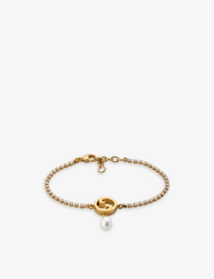 GUCCI: Blondie interlocking G-charm gold-toned metal, faux-pearl and crystal bracelet