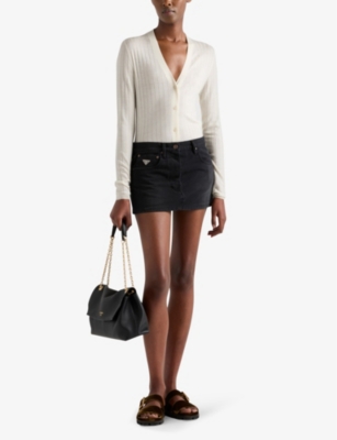 PRADA: Logo-plaque low-rise denim mini skirt
