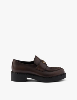 PRADA: Chocolate logo-plaque brushed leather loafers
