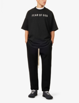 Shop Fear Of God Mens  Logo-print Relaxed-fit Cotton T-shirt In Black