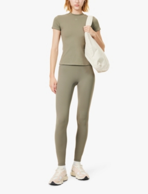 THE COUTURE CLUB WOMENS KHAKI SCULPTING EMBLEM EMBOSSED-BRANDING TAPERED-LEG HIGH-RISE STRETCH-WOVEN LEGGINGS 