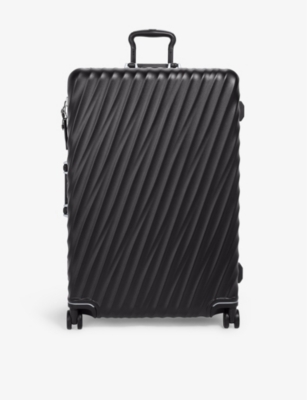 TUMI: Extended Trip expandable four-wheel shell checked suitcase 76cm