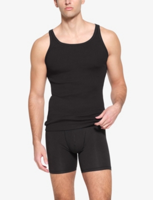 Shop Skims Mens  Ribbed Slim-fit Pack Of Three Stretch-cotton Tank Tops In Onyx