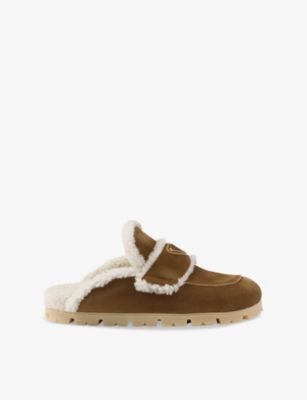 PRADA: Lugged-sole triangle-plaque suede and shearling slippers