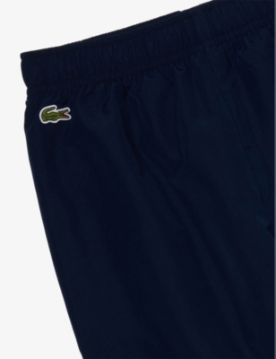 Shop Lacoste Performance Logo-embroidered Tapered-leg Jogging Bottoms 6-1 In Navy Blue/calathea