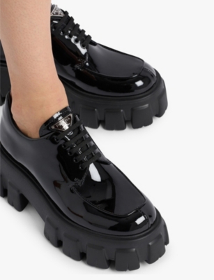 PRADA: Monolith lace-up patent-leather loafers