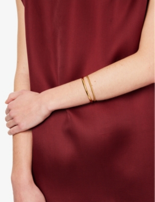 OMA THE LABEL: Twisted 18ct yellow gold-plated stainless steel bangle