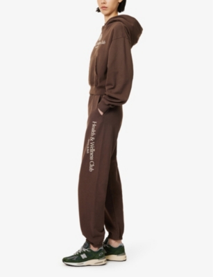 SPORTY & RICH: Brand-print two-slip-pockets straight-leg high-rise cotton-jersey jogging bottoms