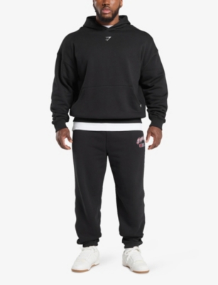 Gymshark Mens Shark Text-print Relaxed Cotton-jersey Jogging Bottoms Gs Black In Gs Black