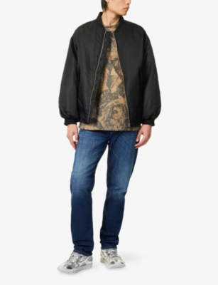 DIESEL: D 1986 Larkee-Beex Tapered-Leg Denim Jeans